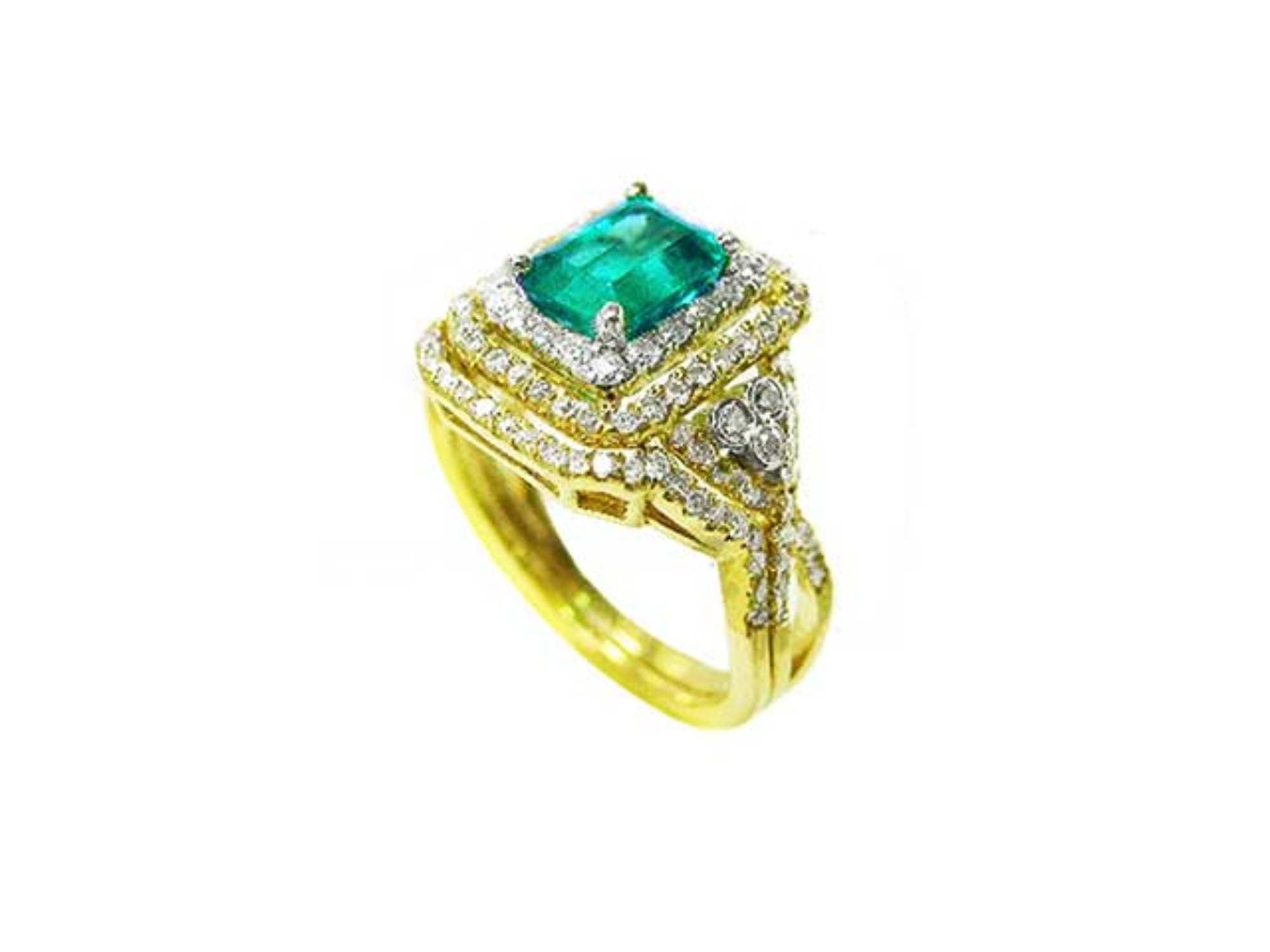 The top and parcial lateral profile of a yellow gold colombian emerald ring with matching band are displayed.