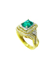 1.31 ct. emerald-cut emerald ring with double diamond halo and matching band in 14K yellow gold.