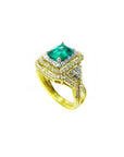 1.31 ct. emerald-cut emerald ring with double diamond halo and matching band in 14K yellow gold.