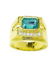Men's 18K yellow gold ring with a rectangular emerald gemstone and five small diamonds.