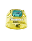 Men's 18K yellow gold ring with a rectangular emerald gemstone and five small diamonds.