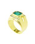 This yellow gold mens emerald ring displays the topside and band design.