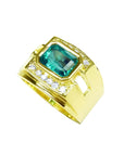 Men's 18K yellow gold ring with a rectangular emerald and surrounding diamonds.
