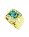 Men's 18K yellow gold ring with a rectangular emerald and surrounding diamonds.