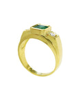 Gold ring for men with a natural emerald and diamond on a white background