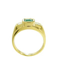 Men's 18K yellow gold ring with a bezel-set Colombian emerald and two side diamonds.