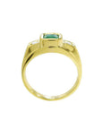 Men's 18K yellow gold ring with a bezel-set Colombian emerald and two side diamonds.