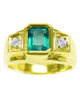 A yellow gold men's emerald ring with accent diamonds on top and side perspective.