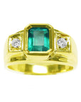 A yellow gold men's emerald ring with accent diamonds on top and side perspective.