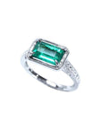 Emerald-cut emerald ring with natural diamonds in 14K white gold.