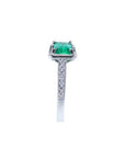 1.21 ct. emerald-cut emerald ring with natural diamonds on a 14K white gold band.