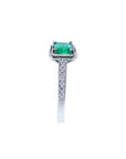 1.21 ct. emerald-cut emerald ring with natural diamonds on a 14K white gold band.