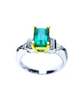 Platinum and 18K yellow gold ring with a 1.21 ct. emerald and natural diamond accents.