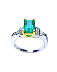 Platinum and 18K yellow gold ring with a 1.21 ct. emerald and natural diamond accents.