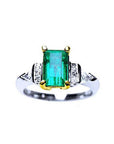 Platinum emerald ring and 18k yellow gold setting with accent side natural diamonds.
