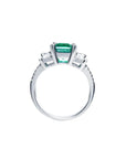 1.88 carat emerald ring with side emerald-cut diamonds and round accents in 18k white gold.