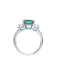 1.88 carat emerald ring with side emerald-cut diamonds and round accents in 18k white gold.