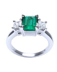 This three stone emerald and side princess cut diamond ring is displaying the top and gallery profile.