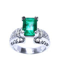 An emerald ring for women emerald-cut 18k white gold, top and sides profile views.