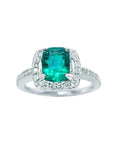 This cushion cut emerald ring for women is placed on a top view position and sides profile.