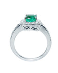 This white gold cushion cut emerald ring showcases its top and lateral gallery profile.