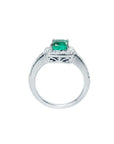 This white gold cushion cut emerald ring showcases its top and lateral gallery profile.