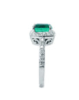 Here an emerald cushion cut and diamond ring showcasing it side profile.