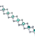 14K white gold bracelet with round cut Colombian emeralds bezel set in diamond-shaped links.