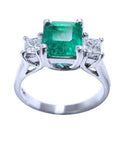 This emerald and princess cut side diamonds ring displays the top and gallery view profile.
