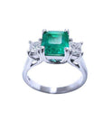1.62 carat emerald engagement ring with side princess cut diamonds in 14k white gold.