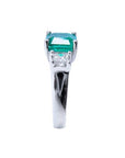 1.62 carat emerald engagement ring in 14k white gold with side princess cut diamonds.