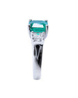 1.62 carat emerald engagement ring in 14k white gold with side princess cut diamonds.