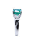 1.62 carat emerald engagement ring in 14k white gold with side princess cut diamonds.