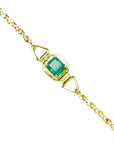 A square natural colombian emerald solitaire bracelet prong set in 14k yellow gold.