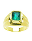 A 14k yellow gold men's natural colombian emerald solitaire ring bezel set.