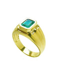 Men's 14K yellow gold solitaire ring with a bezel-set, deep green emerald.