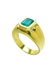 Men's 14K yellow gold solitaire ring with a bezel-set, deep green emerald.