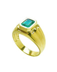 Men's 14K yellow gold solitaire ring with a bezel-set, deep green emerald.