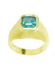 Men's 14K yellow gold ring with a rectangular emerald-cut bluish-green Colombian emerald, bezel set.