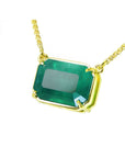 5.52 carat emerald-cut Colombian emerald solitaire necklace in 18K yellow gold.