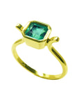 Top and side perspective of a solitaire emerald ring bezel set in yellow gold