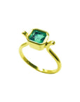 0.81 ct. emerald solitaire ring with a medium bluish-green stone, bezel set in 14K yellow gold.