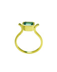 0.81 ct. emerald solitaire ring, bezel set in 14K yellow gold with a unique open shank design.