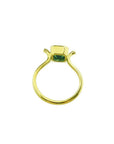 0.81 ct. emerald solitaire ring in 14K yellow gold with a bezel setting.