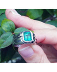 Men's 18K white gold ring with a bezel-set, rectangular natural Muzo emerald.