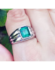 Men's 18K white gold ring with a bezel-set, rectangular natural Muzo emerald.