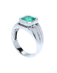 Emeral ring in white gold for men displaying the top and partial side view.