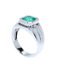Emeral ring in white gold for men displaying the top and partial side view.