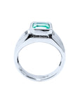 A lateral view of a white gold mens emerald ring displaying its top setting and band design.