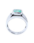 Men's 18K white gold solitaire ring with a bezel-set, rectangular Muzo emerald.